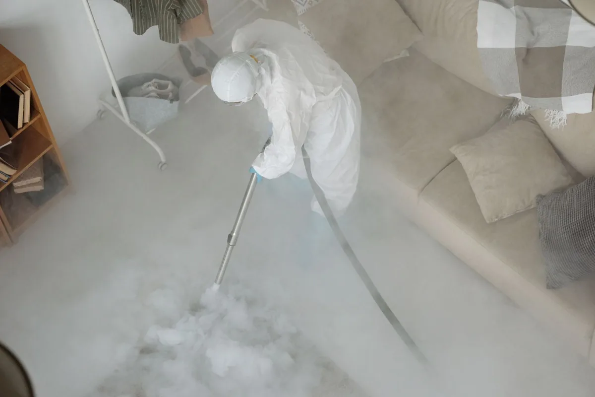 Biohazard cleanup technician in protective equipment, Weweantic, MA